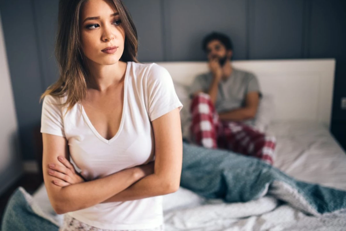 Woman and man on bed