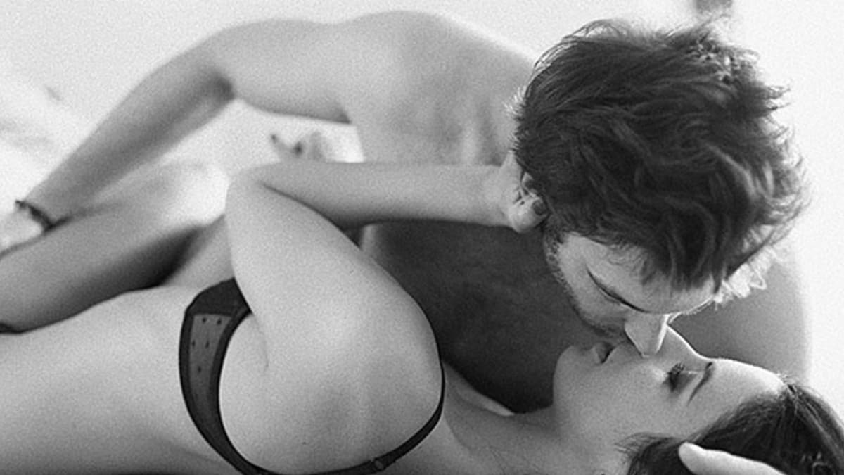 Sexy man and woman in bed