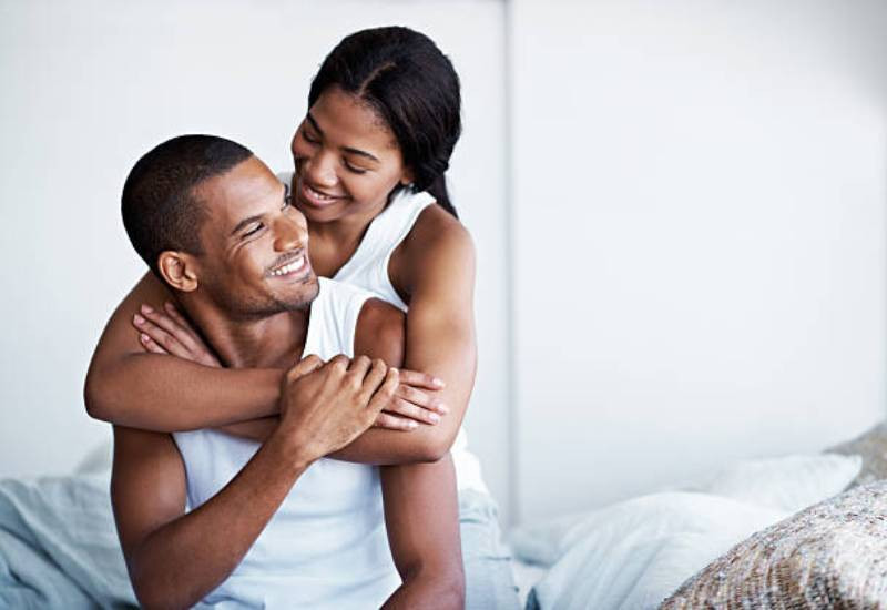 Couple cuddling and laughing