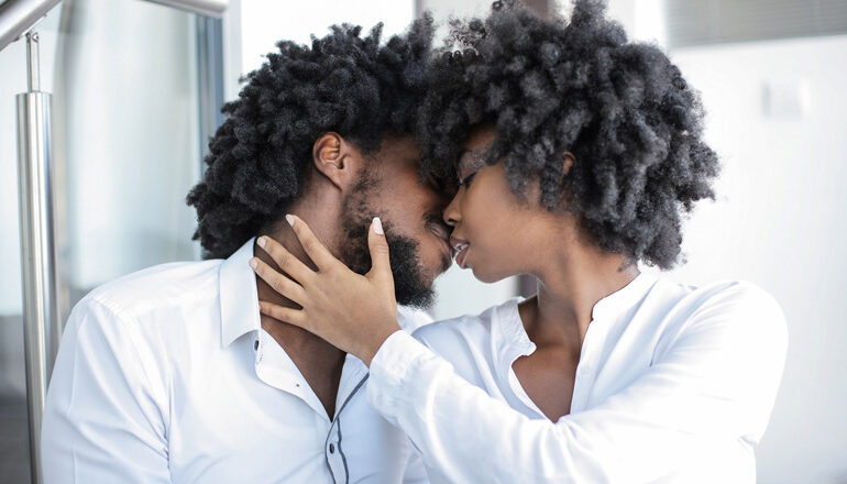 Black couple kissing