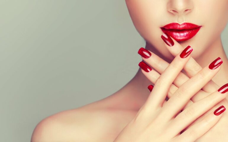 Naked woman with red polished nails