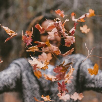 Woman with leaves all over her