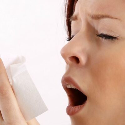 Sneezing woman