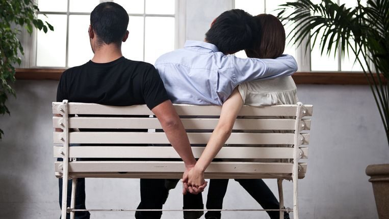 Two men and one woman sitting together