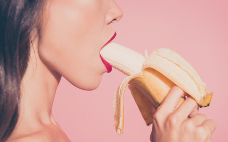 Woman eating a banana