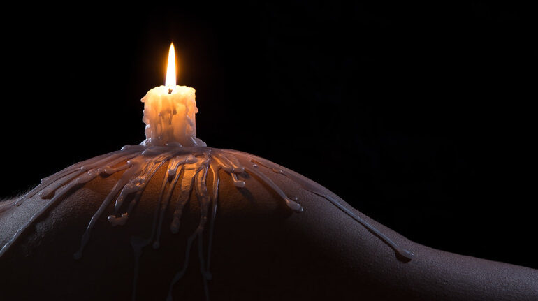 Candle on womans butt
