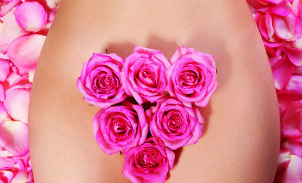 Womans naked body with flowers