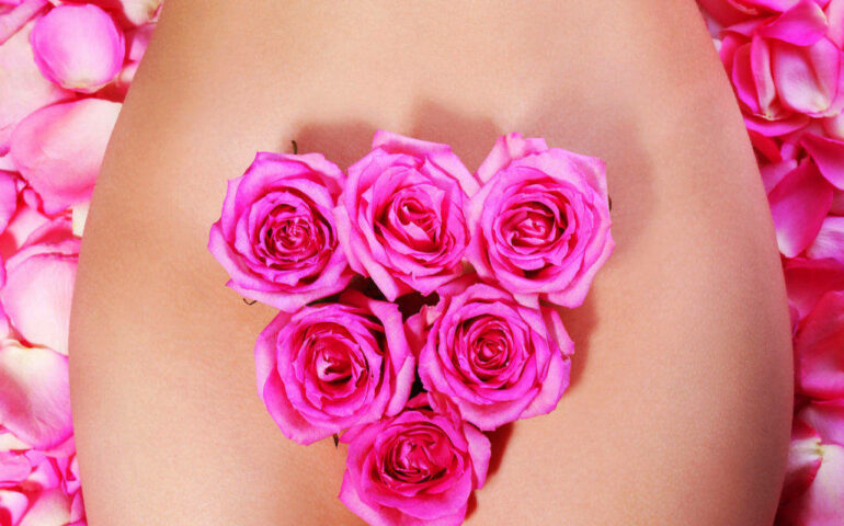Womans naked body with flowers