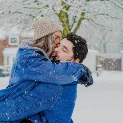 Couple kissing snow