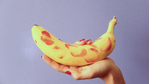 Banana with lipstick kisses all over it